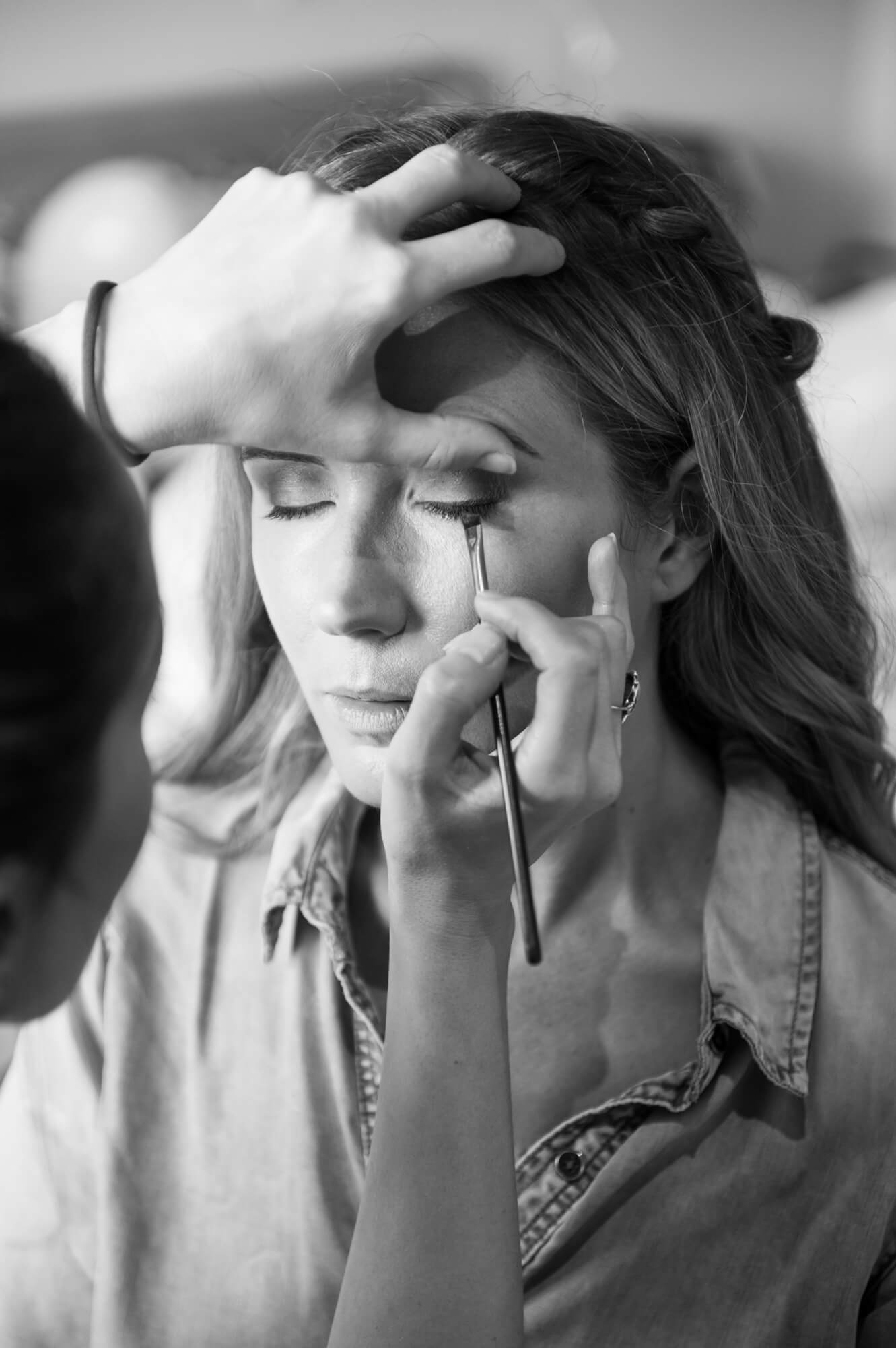 A bride having her make up done by Lauren Gollan Academy